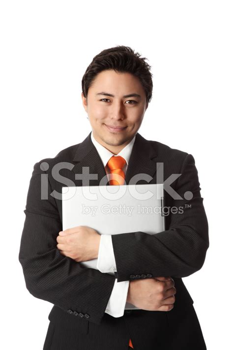 Young Businessman With Laptop Stock Photo | Royalty-Free | FreeImages