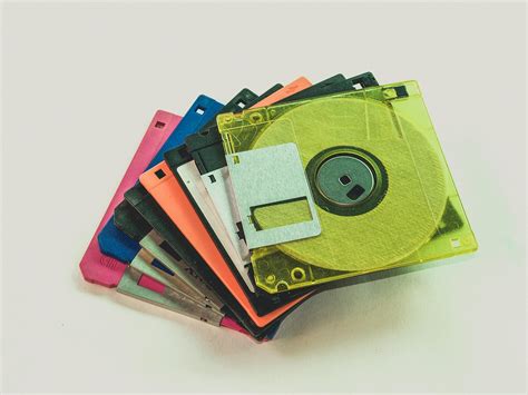 Floppy Disk Lot on White Surface · Free Stock Photo