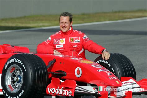 Michael Schumacher with the new Ferrari 248 F1 at Ferrari 248 F1 launch