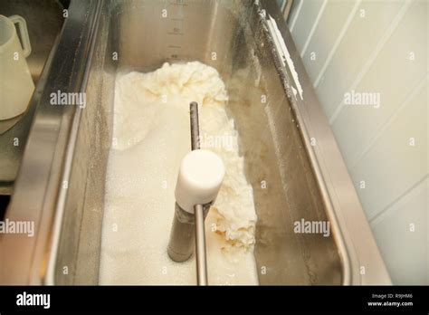 Ice cream making process at ice cream factory, milk and cooking mixing ...