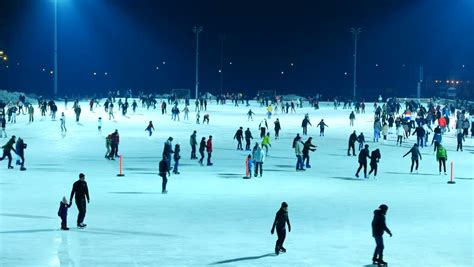 Ice Skating Rink At Night (04). The Open Ice Skating Rink With Crowd Of Young People At Night ...