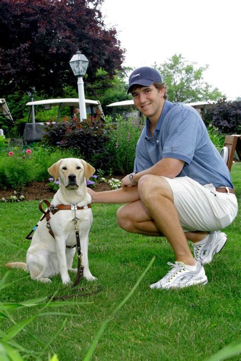 Eli Manning with a Guiding Eyes for the Blind pup! | Labrador retriever, Pup, Labrador