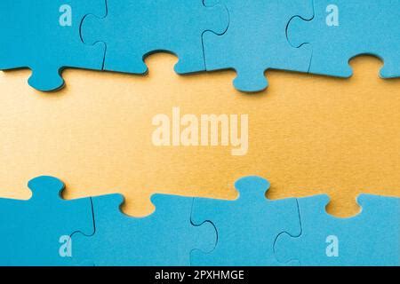 Blue puzzle border with golden background Stock Photo - Alamy