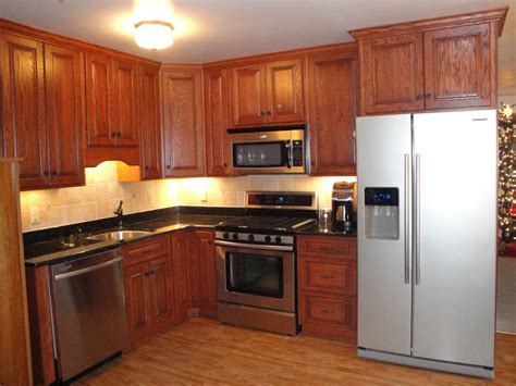 Red Oak Cabinets and Black Granite Counter Top --- Idea.... | Farmhouse kitchen remodel, Ikea ...