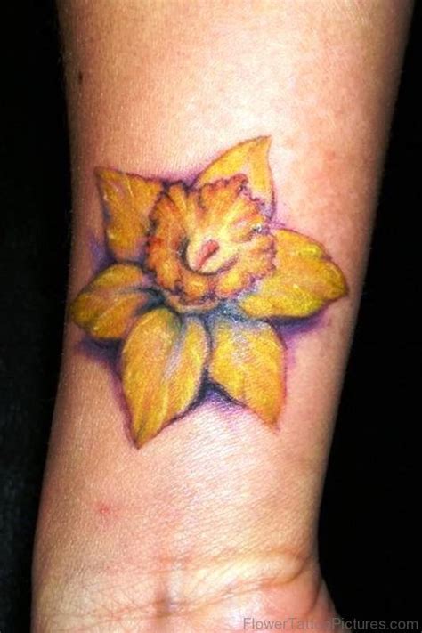 Yellow Daffodil Flower Tattoo On Wrist | Daffodil flower tattoos ...