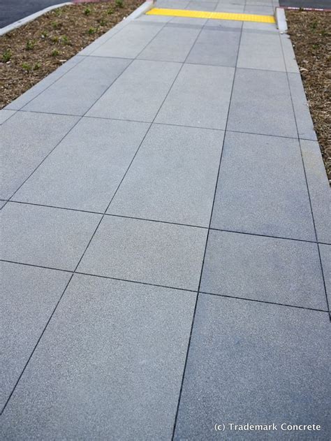 Decorative concrete installed by DCC member Trademark Concrete - sawcut grid pattern & various ...