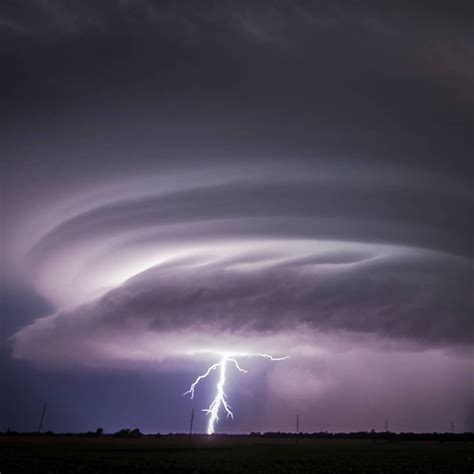 Lightning strikes the ground during a severe thunderstorm just west of ...