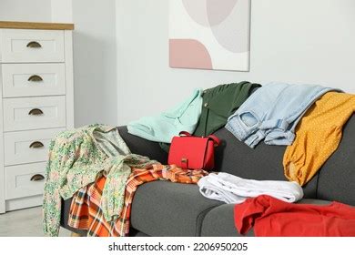 Messy Pile Clothes On Sofa Living库存照片2206950205 | Shutterstock