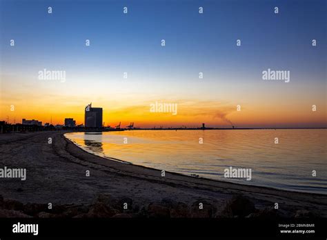 Amazing and colorful sunset above Shuwaikh beach Stock Photo - Alamy