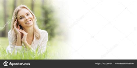 Pretty girl laying on grass Stock Photo by ©yellow2j 192984120