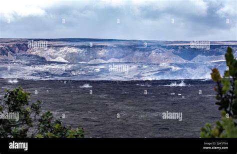 Steam and smoke rise from the mighty Halemaumau Crater. The lava lake ...