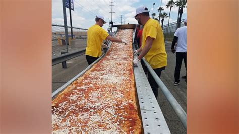 Mile-long pizza breaks Guinness world record, slices help feed homeless - Good Morning America