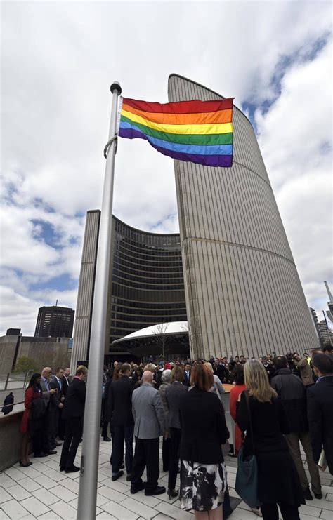 Toronto shows its support by raising pride flag over city hall - The ...