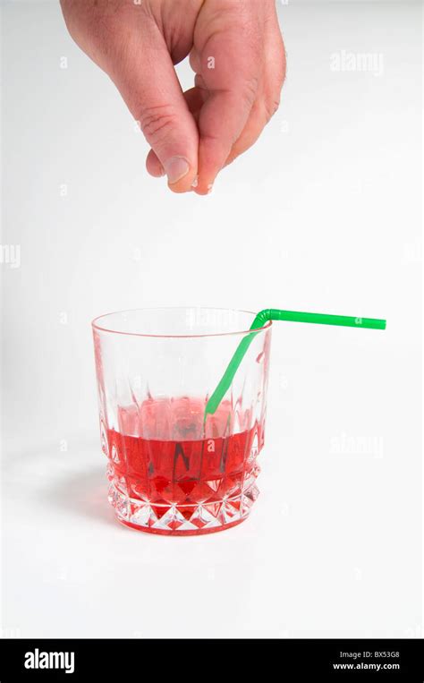 Man spiking drink hi-res stock photography and images - Alamy