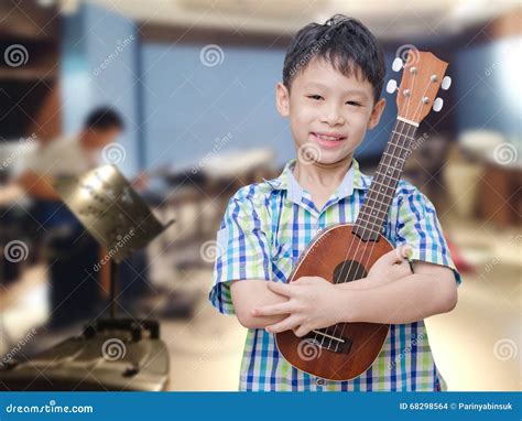 Boy with Ukulele at Music School Stock Photo - Image of happy, japanese: 68298564