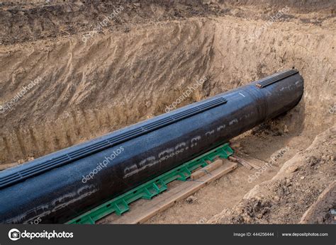 Construction works for laying the pipe. Stock Photo by ©deyanarobova 444256444