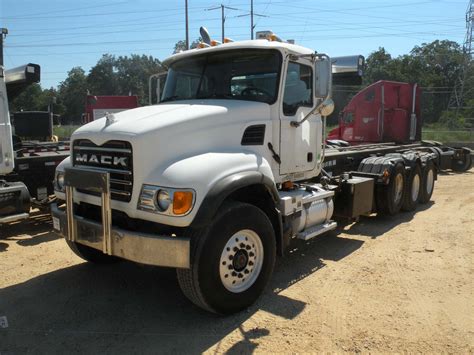 2004 MACK CV713 TRI-AXLE ROLL OFF TRUCK