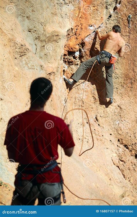 Two Rock Climbers, One Belaying Royalty Free Stock Photography - Image: 16807157