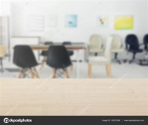 Table against blurred office background — Stock Photo © belchonock ...