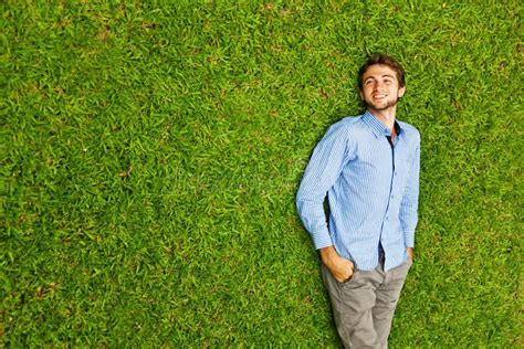 Man laying on a grass stock image. Image of freedom, outdoor - 61747961