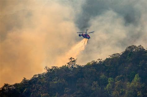 Fire Fighting Helicopter Dropping Water Onto Wildfire Stock Image ...