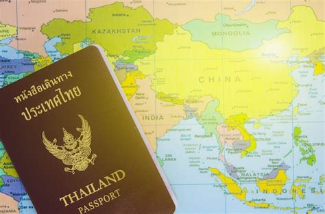 Premium Photo | Thai passport lay on asia map