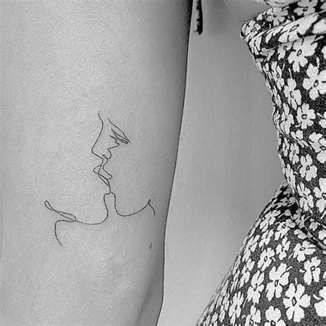 Eiza González's kiss tattoo located on the inner arm.