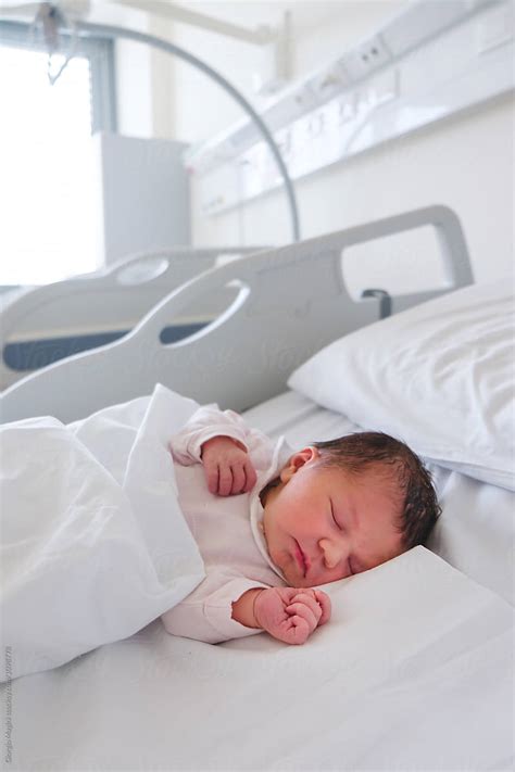 "First Days Of A Newborn Baby Girl Sleeping In Hospital Room" by Stocksy Contributor "Giorgio ...