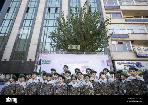 A group of Iranian schoolboys wearing Islamic Revolutionary Guard Corps (IRGC) uniforms perform ...