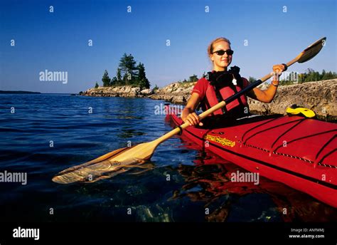 Kayaker paddles on lake huron in five national marine park hi-res stock photography and images ...