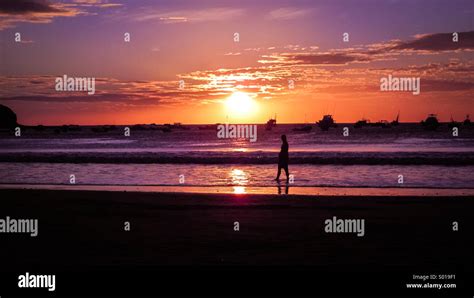 Sunset on tropical island Stock Photo - Alamy