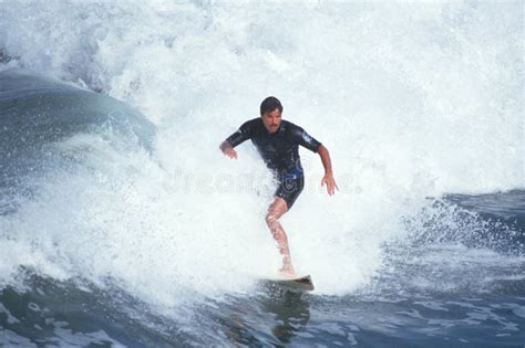 Man surfing with big wave editorial photography. Image of states - 23149872