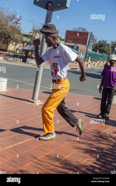 African male performing traditional Pantsula dance in Soweto Township ...