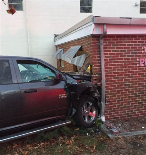 Alcohol bottles found inside man's truck after he smashed into Dracut public works building ...