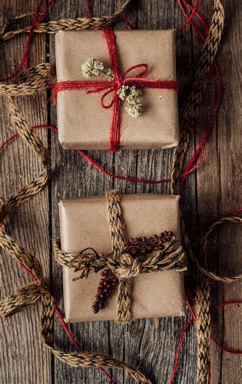 "Two Wrapped Rustic Christmas Gifts" by Stocksy Contributor "Jeff ...