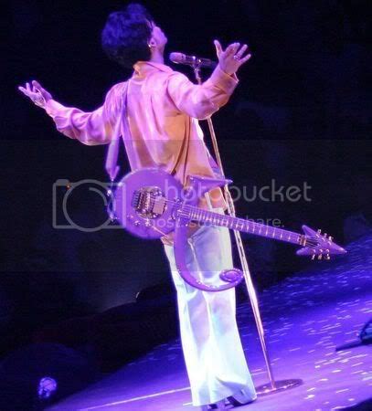 can yall post prince playing guitar pics