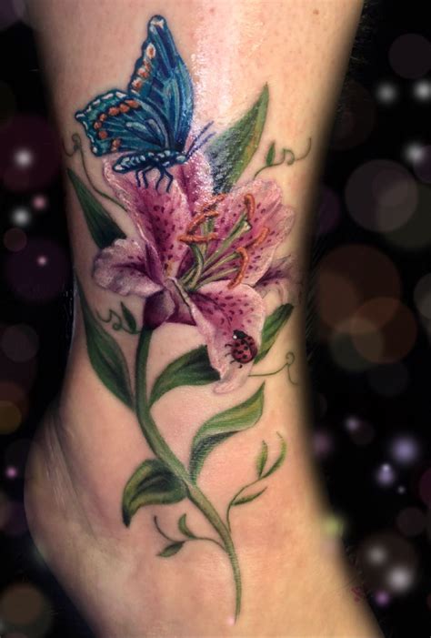 Stargazer lily, ladybug, and butterfly | By Megan | Done at Rose Noir Tattoo & Beauty Studio ...