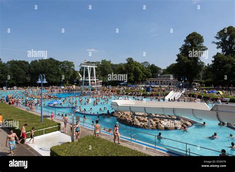 Crowded outdoor swimming pool full of people bathing in Germany, on a hot summer's day Stock ...