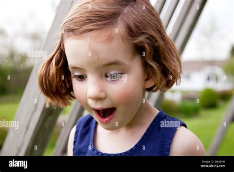 Surprised Girl Looking Down Stock Photo - Alamy