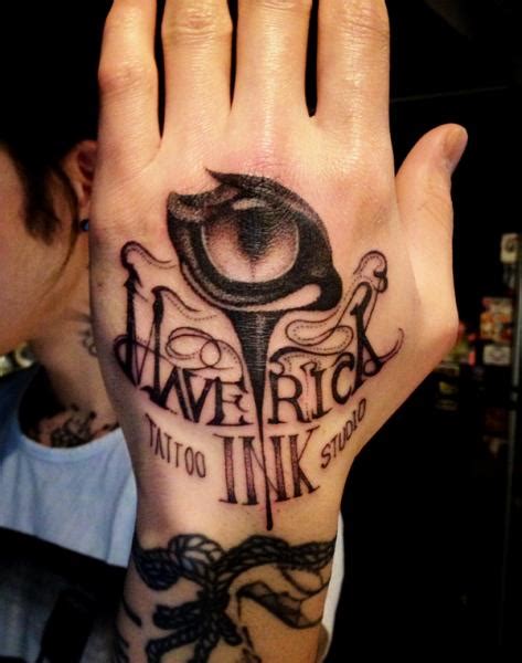 Lettering Hand Eye Tattoo by Maverick Ink