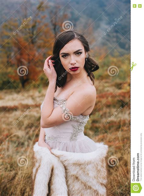 Bride Posing in High Mountain Scenery Stock Photo - Image of person, pose: 78783694