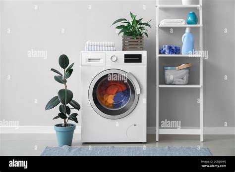 Interior of bathroom with modern washing machine Stock Photo - Alamy