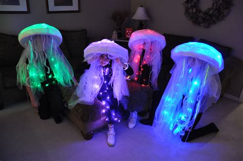 Jellyfish costumes. Made these for our 4 kids. Used LED lights, sombreros, bubble wrap, lac ...