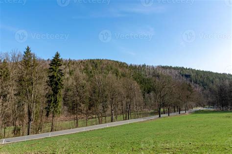 Country road through a landscape 10481367 Stock Photo at Vecteezy