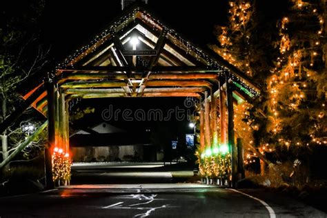 Christmas Covered Bridge with Lights Stock Image - Image of leading ...