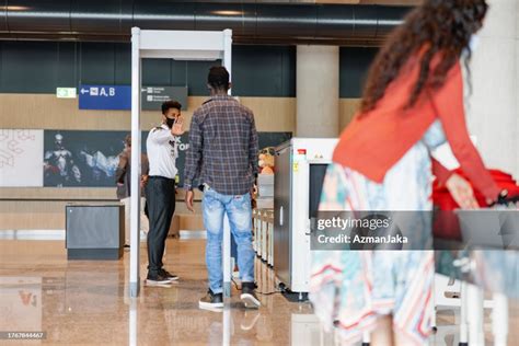 Young African Male Going Through Airport Security High-Res Stock Photo ...