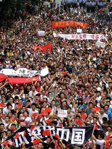 Japan activists land, raise flags on disputed isle