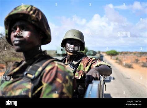 Soldiers patrol the road between Kismayo International Airport and the seaport, checking for ...