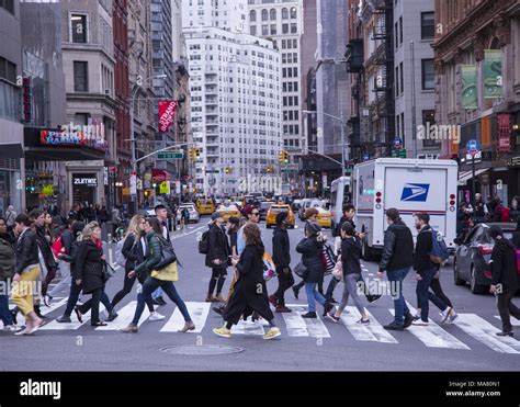 The always busy crosswalk at 14th Street crossing Broadway at Union Square, New York City Stock ...