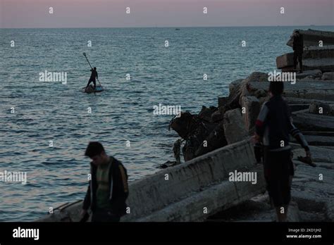 Palestinian fishing boats in the Gaza sea at sunset in Gaza City ...